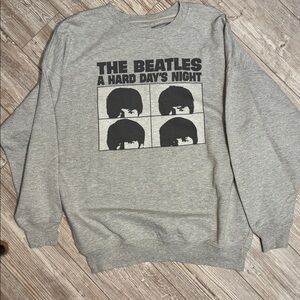 American Eagle (Tailgate) The Beatles Hard Day’s Night sweatshirt in gray.